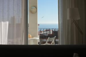 Quiet Studio in Fenals with Balcony, Pool and Workspace for Medium-Term Rental