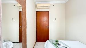 Spacious 2BR with Working Room at Grand Palace Kemayoran Apartment By Travelio