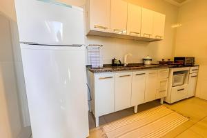 Flat completo em residencial + ar cond. e vaga