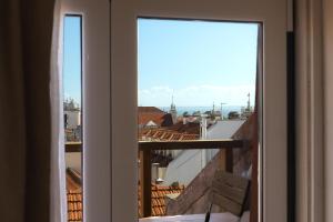 Bairro Alto Rooftop with Balcony and View by Homing