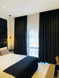 The Monochrome Apartment 209 - Urban Chic Escape - Open Plan Bathroom with Bathtub