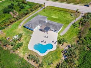 Vacation home with private pool and game room, minutes from the beach