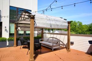 Stylish Boho Courtyard Loft with King Beds in 12S at 1 of 7 Themed Lofts at Cowrite, Find Coffee and Tacos Downstairs, Complimentary Spin Class, Walk to Shopping in 12 South, 10 Minutes to Broadway, Parking, 24 Hr Hospitality