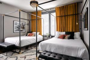 Stylish 2 Suite Penthouse Walk to Shopping, Food, 1 of 7 Themed Lofts at Cowrite, Find Coffee and Tacos Downstairs, Complimentary Spin Class, Walk to Shopping in 12 South, 10 Minutes to Broadway, Parking, 24 Hr Hospitality