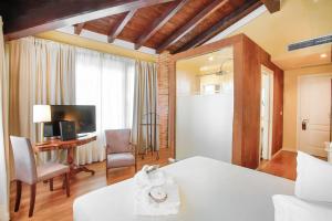 Comfort Triple Room with Garden View room in Le Ali Del Frassino