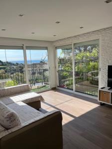 Appartement dans villa vue mer piscine partagée