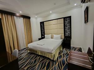 فندق المهاجر للشقق المخدومة بالبوادي