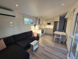 Modern, lakeside cottage with a glimpse of Lake Vänern