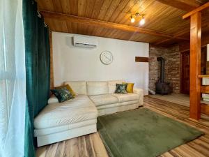 Drewniany zakątek - domek z sauną i balią