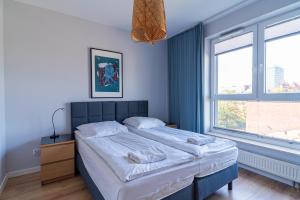 Modern, two bedroom, shipyard view apartment by Grand Apartments