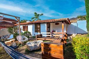 Exclusiva cabaña con tina en piedra, fogata y cine