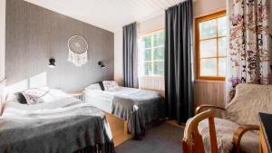 Isokenkäisten Klubi - Wilderness Lodge