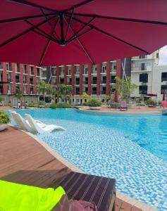 Dagos condo Primeworld with balcony and pool view