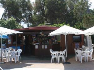 Apt with terrace and pool Steps from the sandy beach