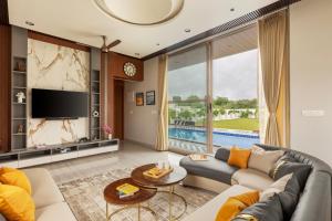 SaffronStays Raaga - luxury 4BR villa with private pool, lawns, gazebos & sweeping Aravalli hill views