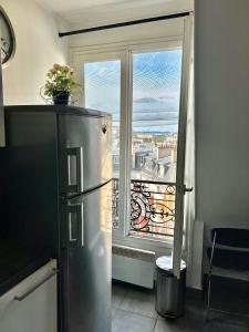 Studio Haut Haut de Gamme - Bain de lumière - Vue sur Paris