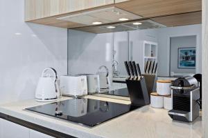 Poolside at 28 Luxe Newstead Apartment Work-Relax-Play