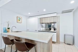 Poolside at 28 Luxe Newstead Apartment Work-Relax-Play