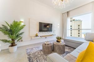 Panoramic Sea and Canal Views from High-Floor 2BR, Steps from Tram and Marina Beach, Shams 2, JBR by Dekuxe Holiday Homes