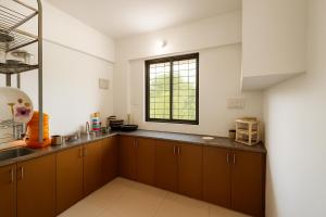 New Spacious 2BHK apartments in Tirupati Near Railway Station with fully equipped kitchen, AC bedrooms, Washing Machine, 24 hours water, caretaker service, and ample space for car parking & ideal for families and pilgrims