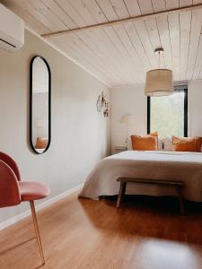 Luxurious red cottage with wood stove near lake