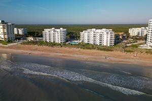 Updated direct oceanfront corner condo with large wrap-around balcony and heated pool