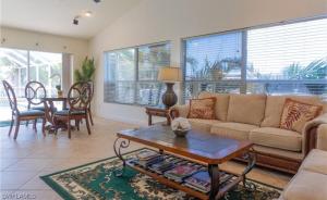 Sunshine paradise retreat with heated pool and canal access