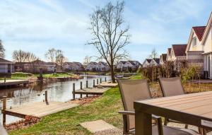 Nice Home In Makkum With Lake View