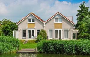 Nice Home In Makkum With Lake View