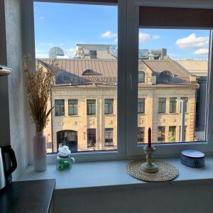 Bright and cozy apartment in the city center with balcony