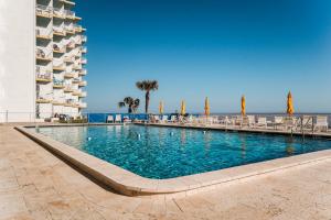 New listing! Direct oceanfront condo with a balcony, heated pool, and tennis court