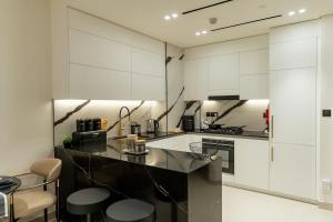 1BR in Trillionaire Residences by Binghatti with canal view