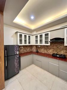 2bhk luxury White lotus apartment by madanan