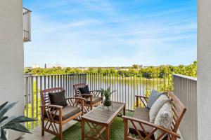 Lovely River View Walk to Downtown has Garage and Balcony