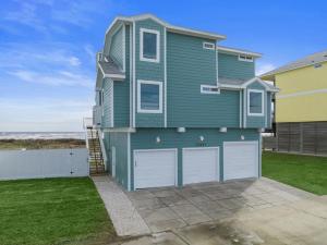 Oceanfront home with pool, large decks, fire pit and private walkover to the beach