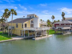 Canal Front Home with Boat Slip, Game Room, and Great Water Views