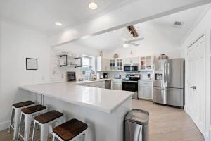 Canal Front Home with Boat Slip, Game Room, and Great Water Views