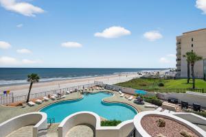 New Listing! Updated direct oceanfront condo with a pool, hot tub, and garage parking