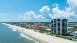 New Listing! Updated direct oceanfront condo with a pool, hot tub, and garage parking