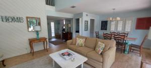 End Unit at Club Villas! This gorgeous, coastal coastal inspired villa is the ultimate beach-pad!