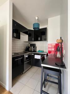 Logement proche centre daffaires calme et terrasse