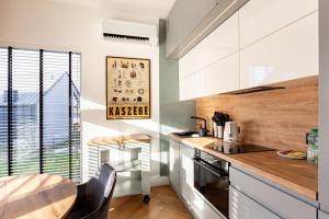 Willa 27P Lakeside Retreat Łączyno by BookingHost