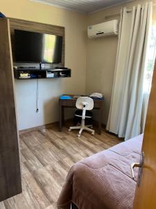 Hospedagem familiar com piscina e churrasqueira