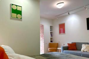 Modern 1BR with Orange Accents