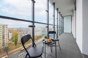 Kasprzaka Comfy Apartment near Metro Plocka with AC by Noclegi Renters