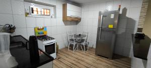 Casa com garagem no coração de Arraial!