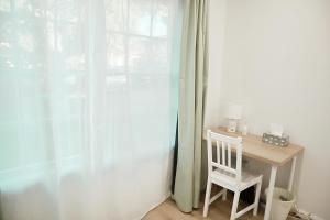 Queen room with shared bathroom