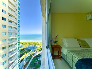 Apto Frente Mar Bali Beach Home Club 3 Quartos Climatizados Cozinha Completa Sacada com Churrasqueira 2 Vagas de Garagem Piscina borda infinita Sauna Academia Cinema Quadra Salão de Jogos Pé na Areia 15min do Beto Carrero