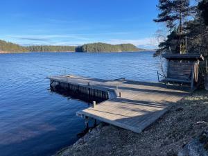 Accommodation near lake and forest including rowing boat