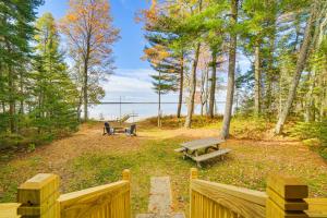 Dock and Fire Pit Lakefront Cottage in Gould City!